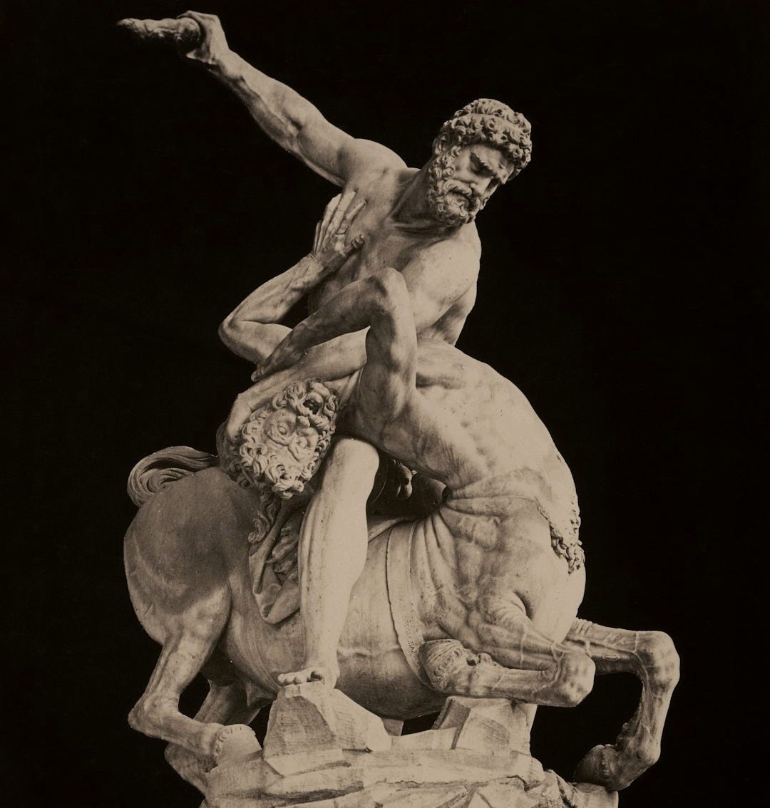 Man battles a centaur in a dramatic sculpture. Man battles a centaur in a dramatic sculpture.