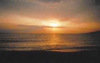 Three images of the sunset over a beach. The final image features sun rays scattered across the clouds