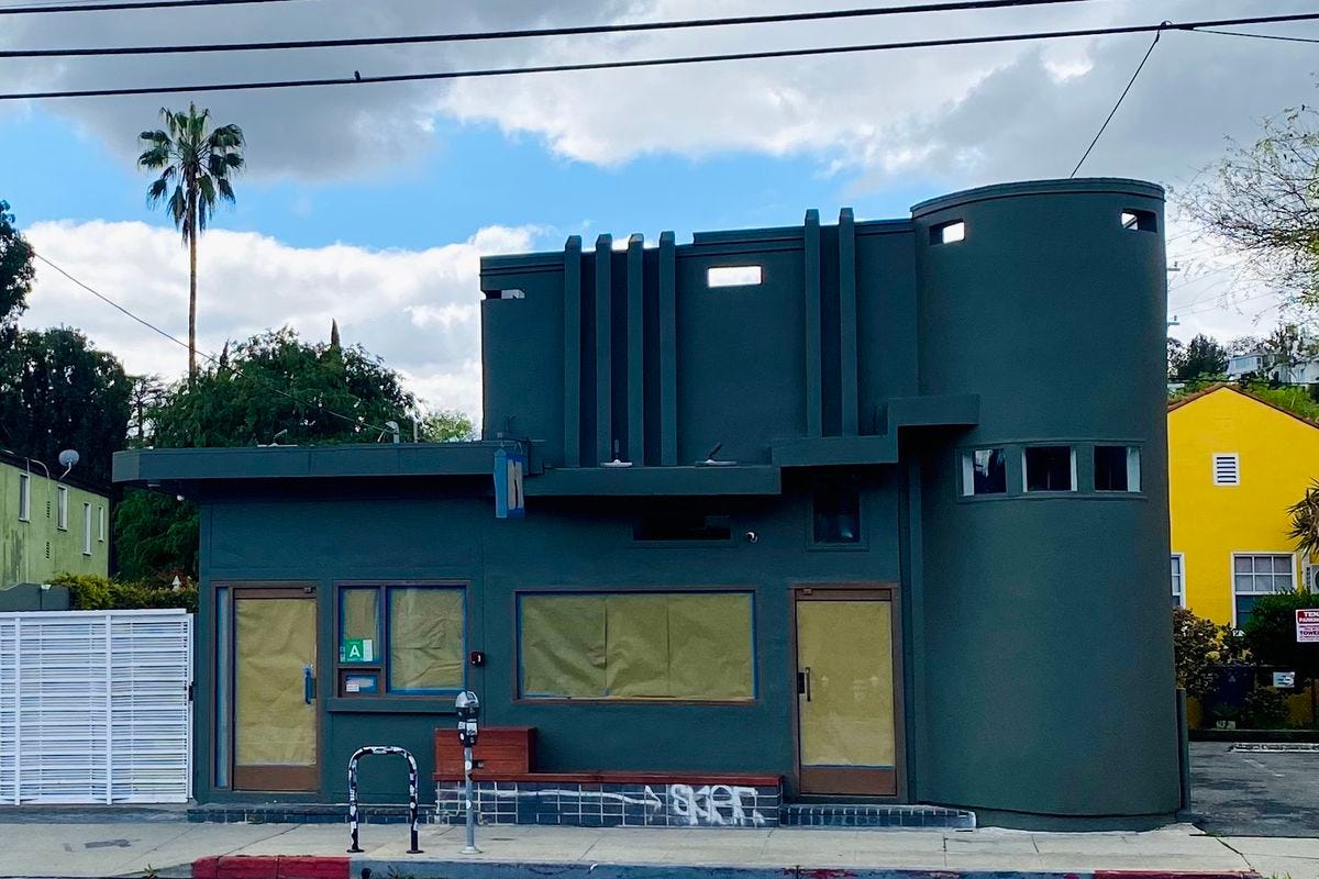 A cloudy day sits over a newly painted Argento restaurant exterior with paper in the windows. A cloudy day sits over a newly painted Argento restaurant exterior with paper in the windows.