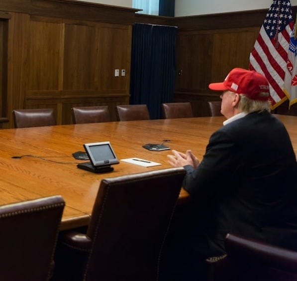 black flat screen tv turned on near brown wooden wall