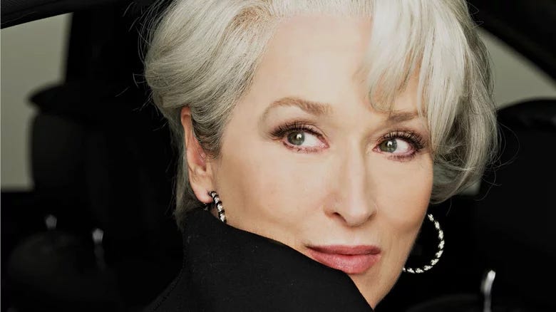 Close up of Meryl Streep from The Devil Wears Prada. She is looking over her shoulder.