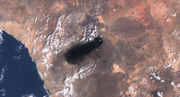 Satellite image showing a plume of black smoke rising from an area of Saudi Arabia's East-West oil pipeline south of Medina. Satellite image showing a plume of black smoke rising from an area of Saudi Arabia's East-West oil pipeline south of Medina.