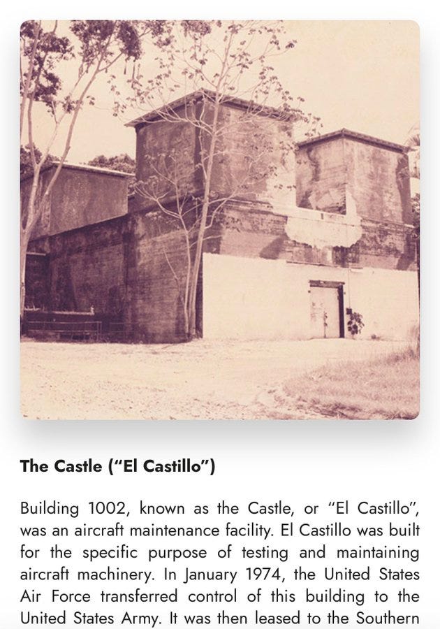 A black-and-white photo of a large, two-story building with a rectangular shape and multiple windows. The structure has a rugged, weathered appearance with visible doors and surrounding trees. Text overlay reads "The Castle (\'El Castillo\')" and "Building 1002".