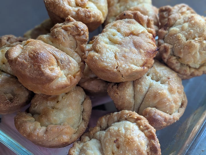 The pies. Should have gotten a better angle on the squash filling. So good. I love how cute and rumpled the look coming out of the muffin tins.