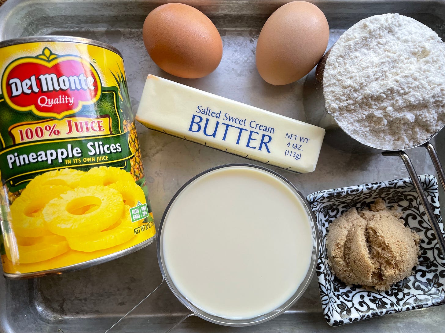 ingredients for c3po pancakes: pineapple slices, milk, butter, eggs, flour, brown sugar. 