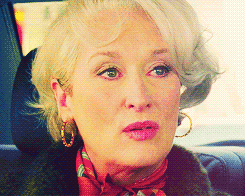 Movie still of Meryl Streep as Miranda Priestly in The Devil Wears Prada, sitting in the back of a car with a tired, unimpressed, and skeptical expression, perfectly channeling beauty editor disdain. Movie still of Meryl Streep as Miranda Priestly in The Devil Wears Prada, sitting in the back of a car with a tired, unimpressed, and skeptical expression, perfectly channeling beauty editor disdain.