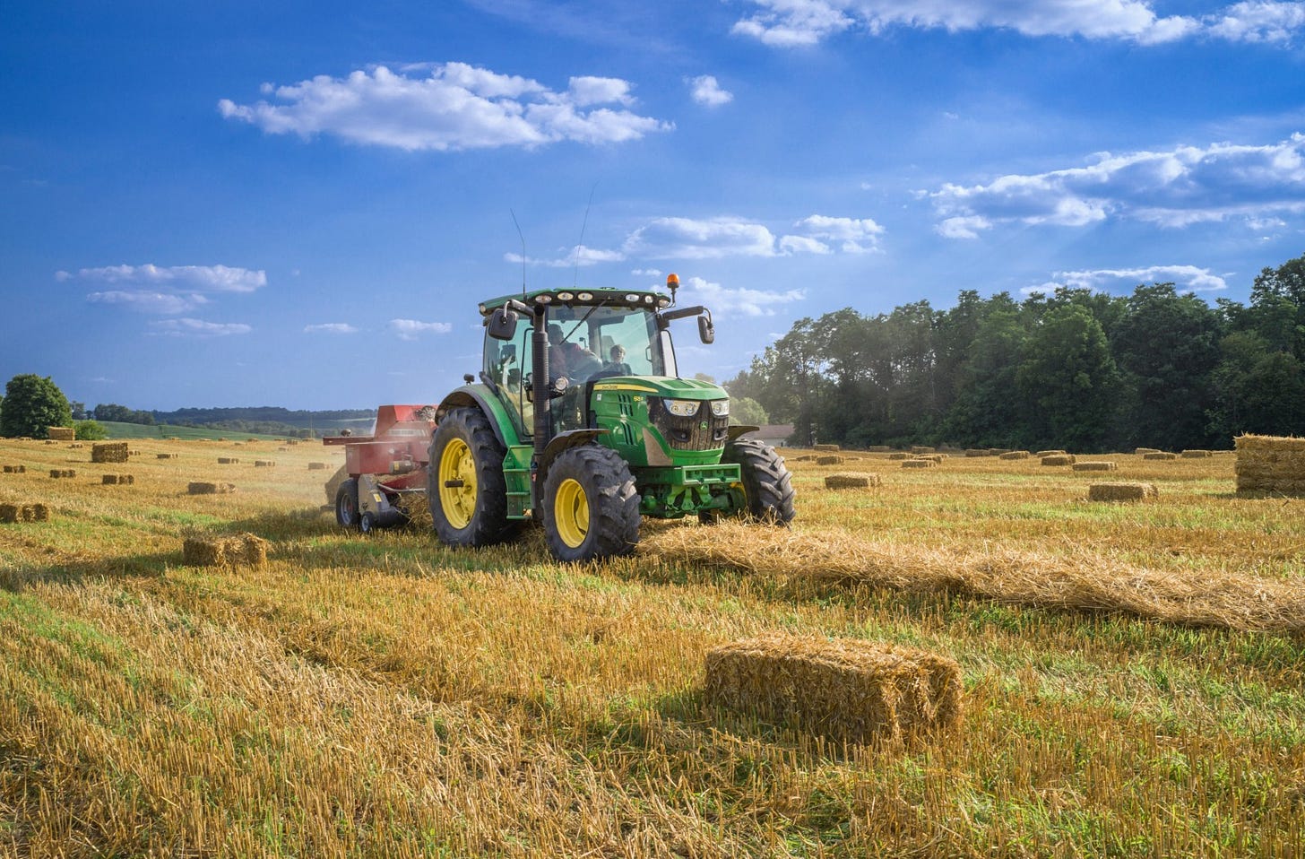 modern tractor bailing straw modern tractor bailing straw