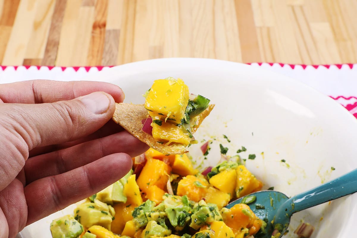 mango avocado salsa on a tortilla chip