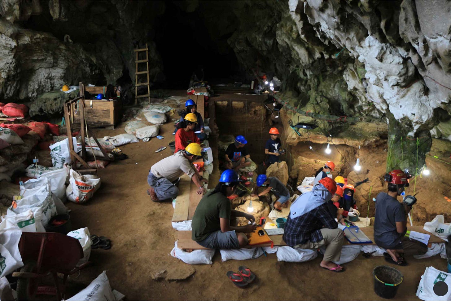 Archaeologists working in a cave