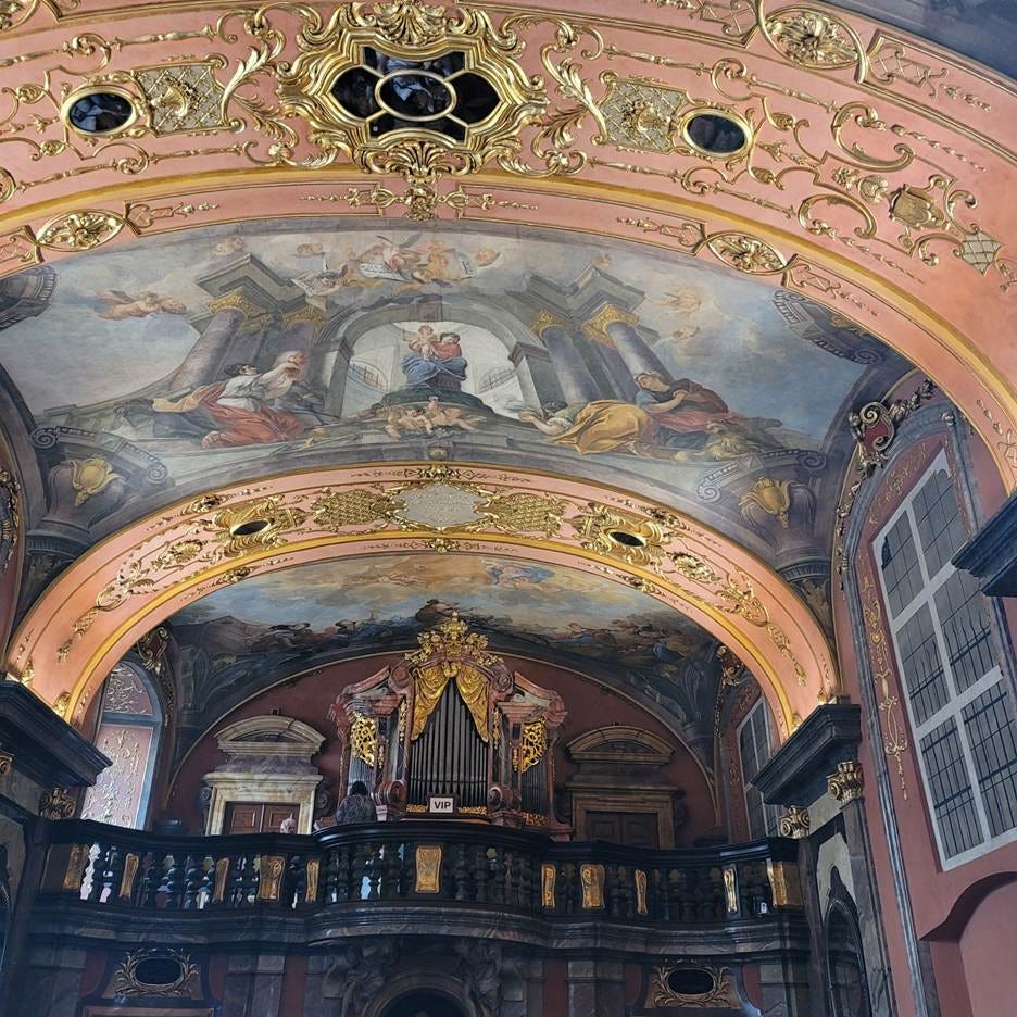 A painting on the ceiling of a building

AI-generated content may be incorrect.