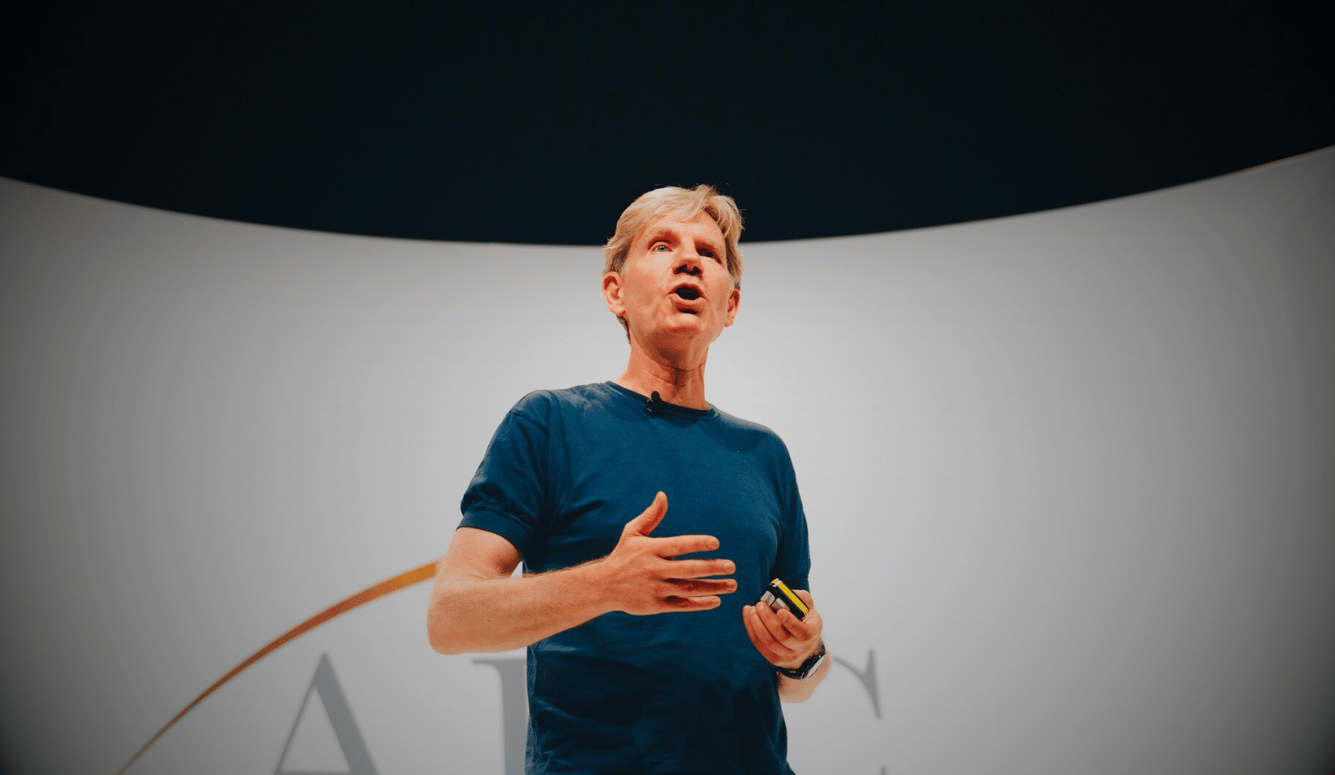 Bjorn Lomborg is a white, middle-aged man who speaks on stage. 