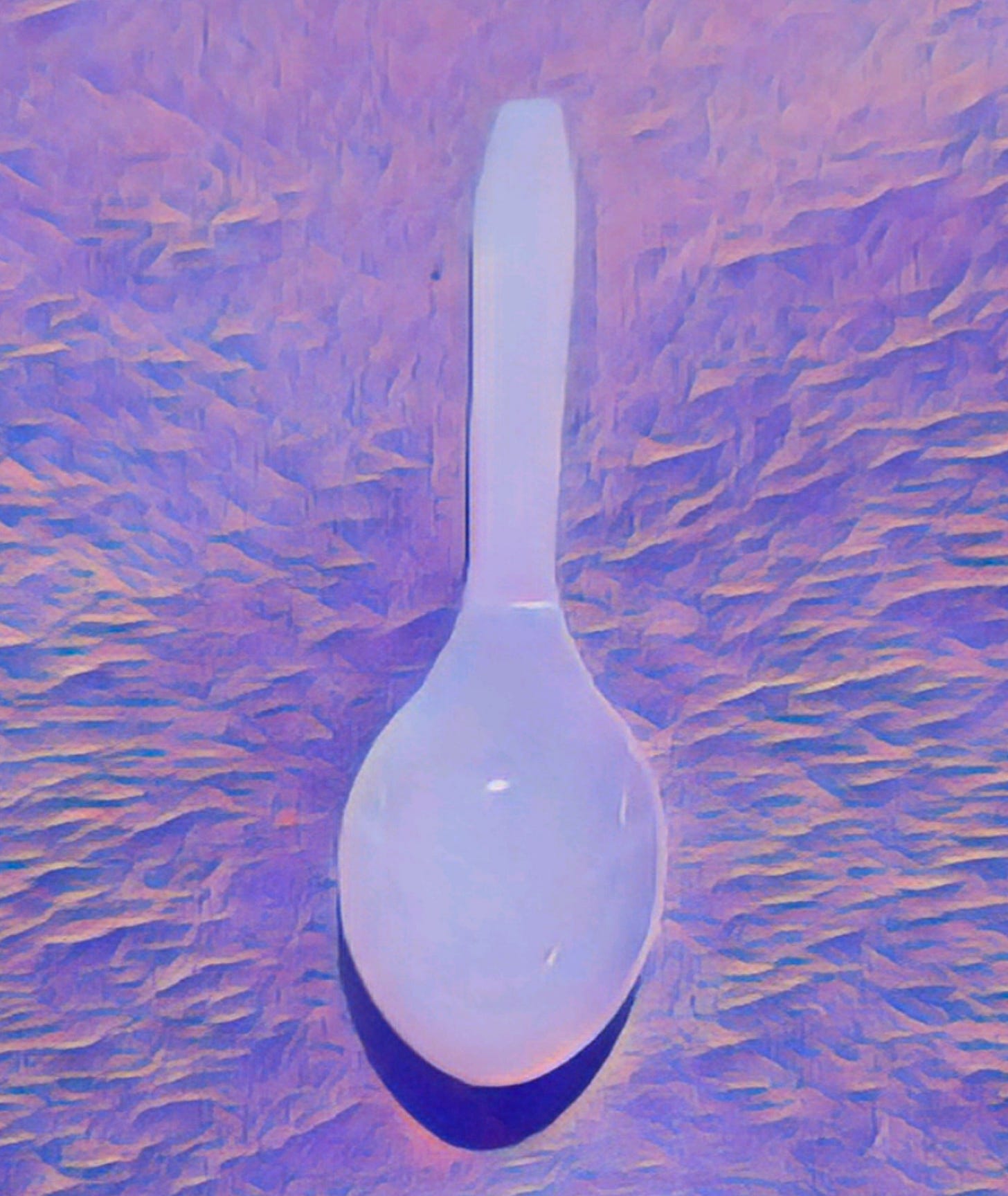 An image of a white plastic spoon.