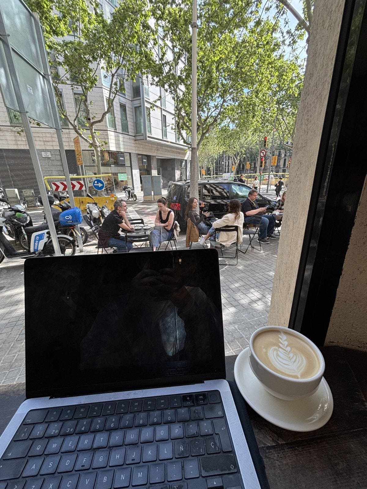 enjoying my latte at Morrow's Coffee