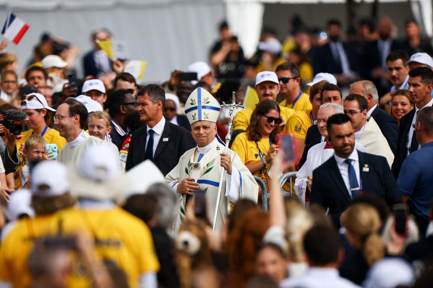 Pope Leo XIV walks through the crowd with his crozier before Mass at the Place de la Concorde Pope Leo XIV walks through the crowd with his crozier before Mass at the Place de la Concorde