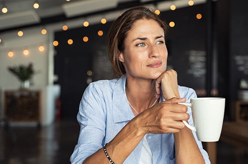 A woman questioning her beliefs about attracting love
