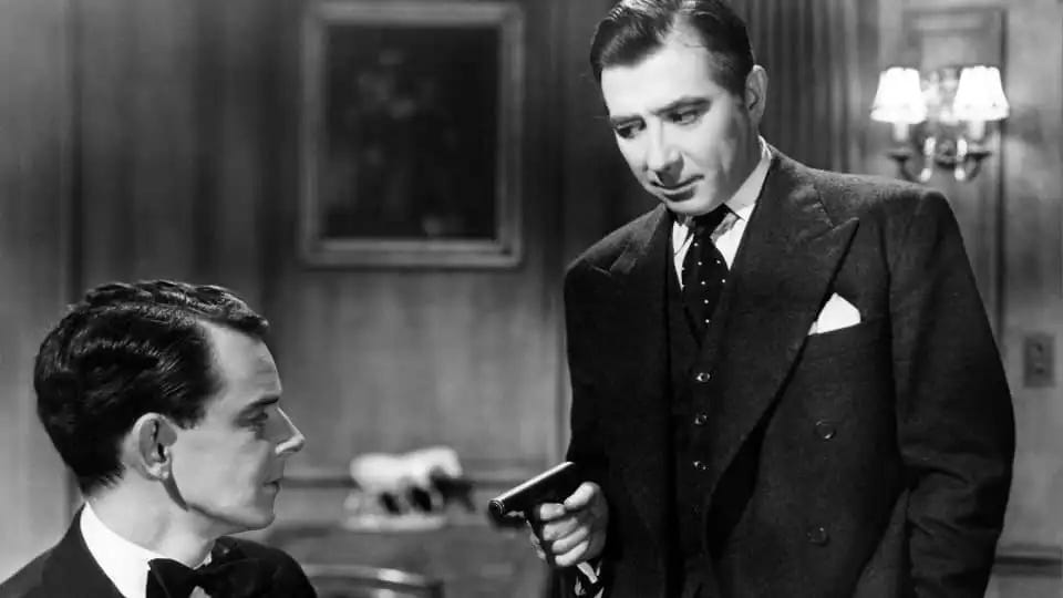 Robert Newton holds a gun on Phil Brown in Obsession