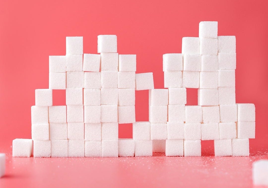 white sugar cube forming lines