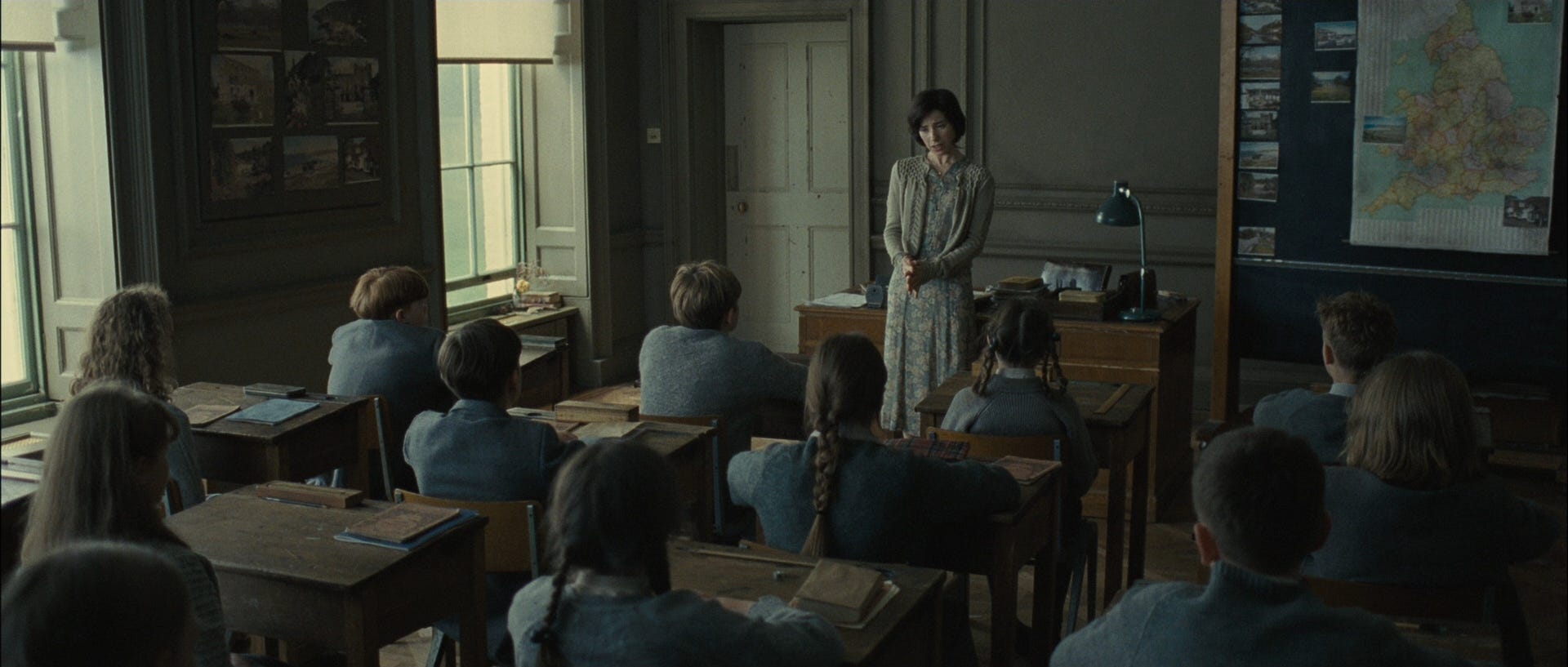 Students and a teacher in a classroom at Hailsham, from the movie adaptation of Never Let Me Go Students and a teacher in a classroom at Hailsham, from the movie adaptation of Never Let Me Go