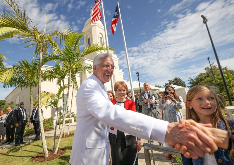 Elder D. Todd Christofferson shakes hands on the grounds of the San Juan Puerto Rico Temple on the dedication day