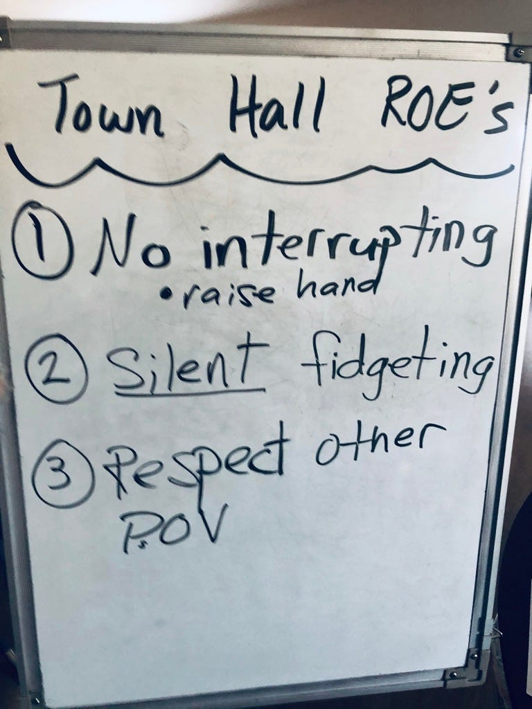 whiteboard with black marker writing