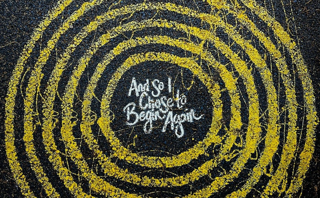 yellow and black round logo