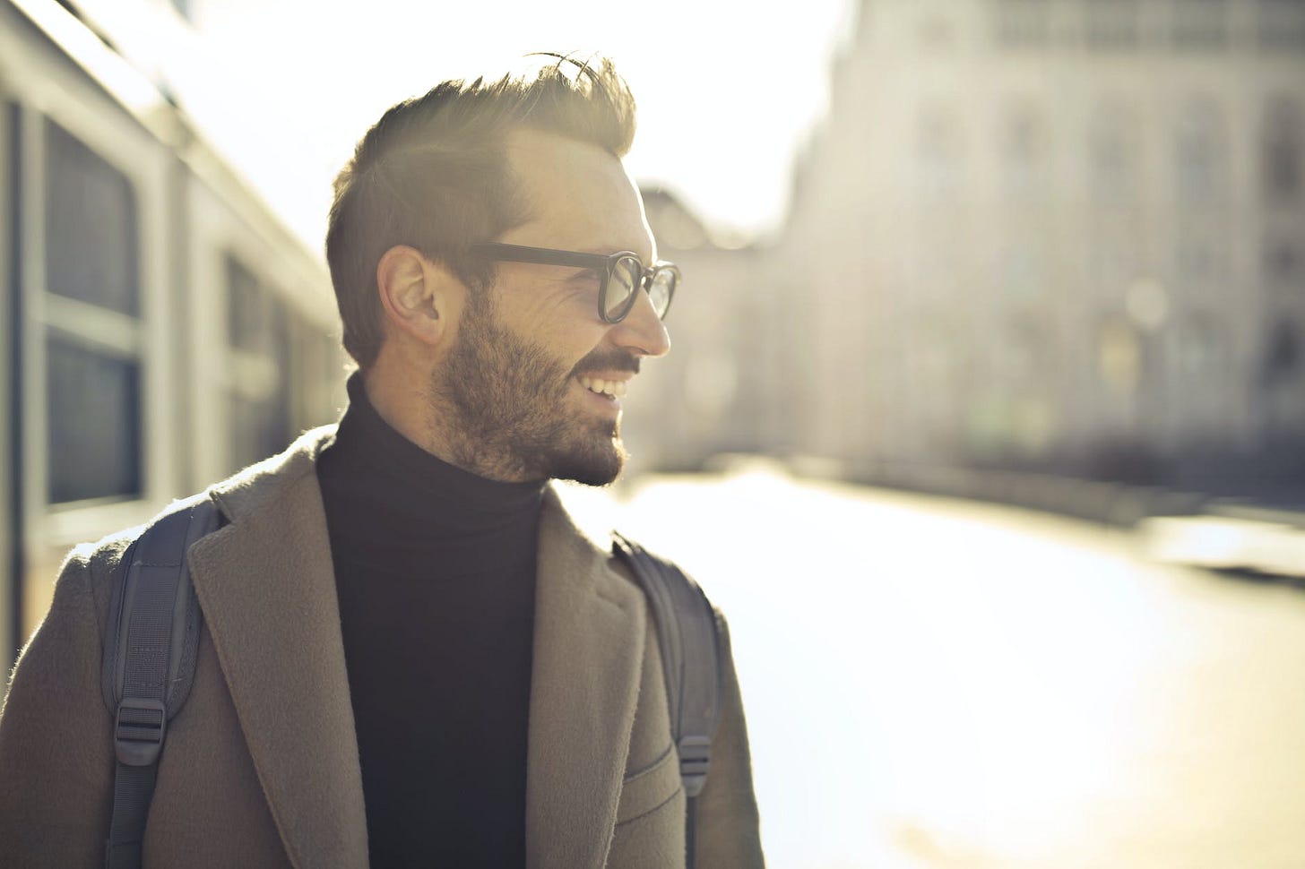 shallow focus photography of man wearing eyeglasses working to improve his self-esteem