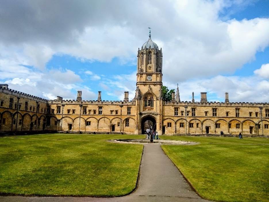 A building with a tower and grass lawn
AI-generated content may be incorrect. A building with a tower and grass lawn
AI-generated content may be incorrect.