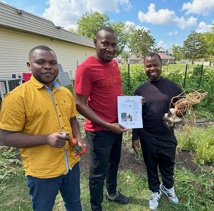 Image 1: A man holds a large leaf in his left hand and veining from the leaf in his right hand. A woman looks over at what is in his hands. Image 2: A group of three men stand in front of the Grow Pamoja garden with items in their hands. The first holds a bottle of hot sauce, the second holds a flyer talking about a farm field day, and the third holds garlic.