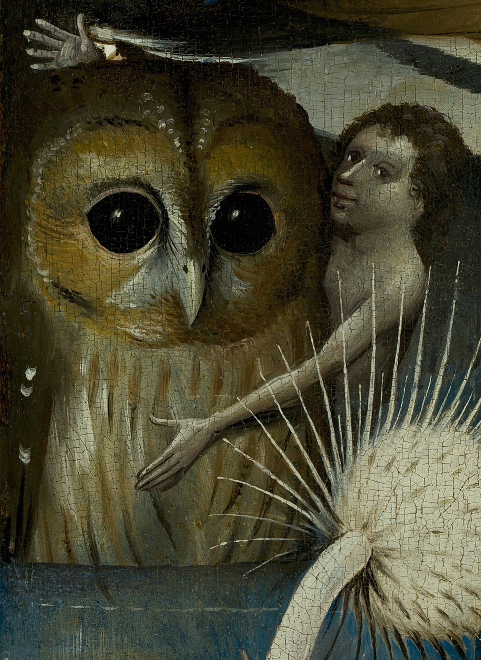 A naked person embraces a giant owl standing waist-deep in water with a 'ta-da!' sort of gesture.