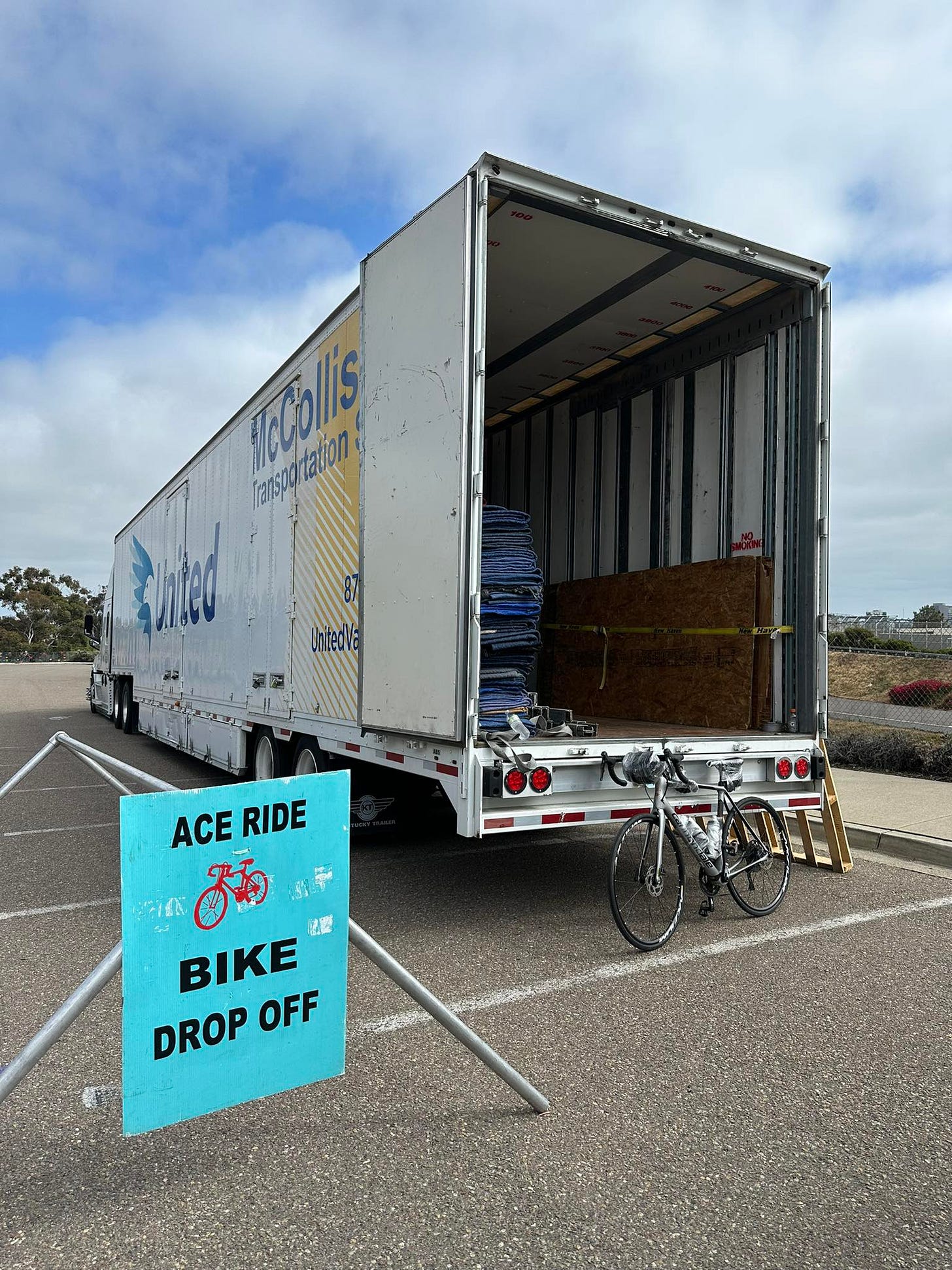 May be an image of motorcycle, bicycle, road and text