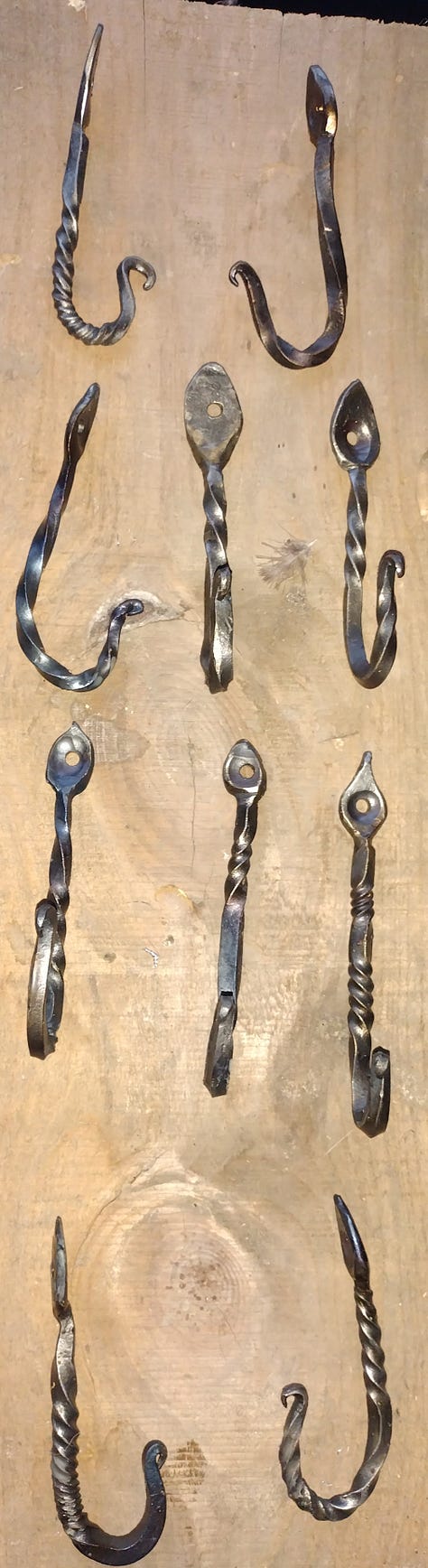Photos of the project progressing from rebar to final hooks.