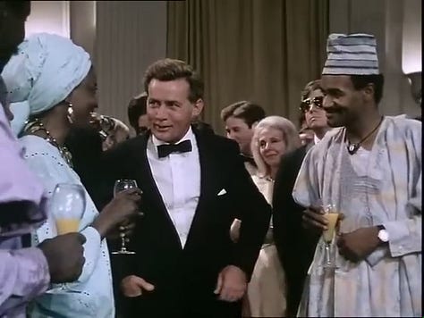 John talking to African diplomats; Robert (with Evelyn Lincoln, played by Veronica Castang) & Martin Luther King, Jr. on a phone call.