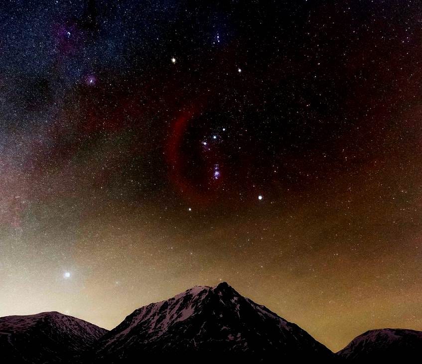 A mountain range with stars in the sky

AI-generated content may be incorrect.