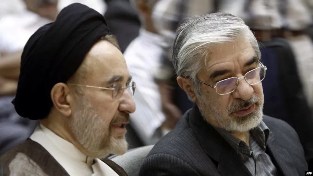 FILE - Mohammad Khatami (L) and Mir Hossein Mousavi attend a memorial service at a mosque in Tehran, Iran, July 31, 2009. FILE - Mohammad Khatami (L) and Mir Hossein Mousavi attend a memorial service at a mosque in Tehran, Iran, July 31, 2009.