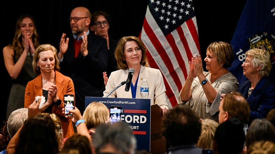 A photo of Judge Susan Crawford with supporters after her victory in the Wisconsin state supreme court race.
