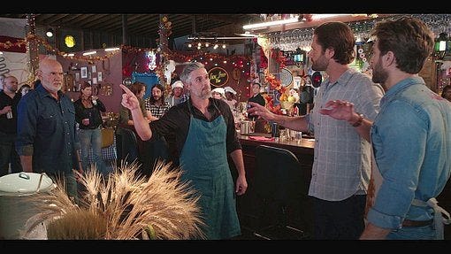 Walker Cordell holding off angry people at chili cook up contest. Walker Cordell holding off angry people at chili cook up contest.