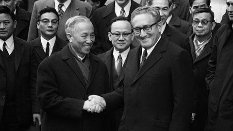 US National Security Adviser Henry Kissinger (R) shakes hand with Le Duc Tho, leader of North Vietnam delegation, after the signing of the Paris Peace Accords on 23 January 1973 in Paris, France. US National Security Adviser Henry Kissinger (R) shakes hand with Le Duc Tho, leader of North Vietnam delegation, after the signing of the Paris Peace Accords on 23 January 1973 in Paris, France.