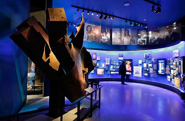 Steel from the World Trader Center north tower floors 97 and 98, left, is displayed at the National Sept. 11 Memorial Museum. (AP Photo)