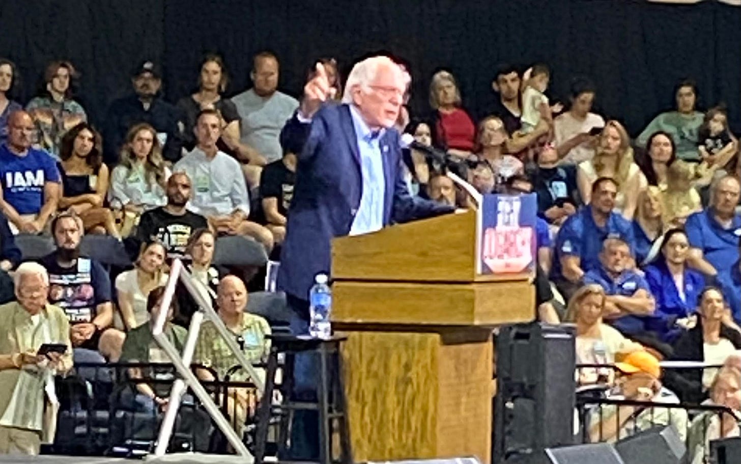 May be an image of 2 people, crowd and text