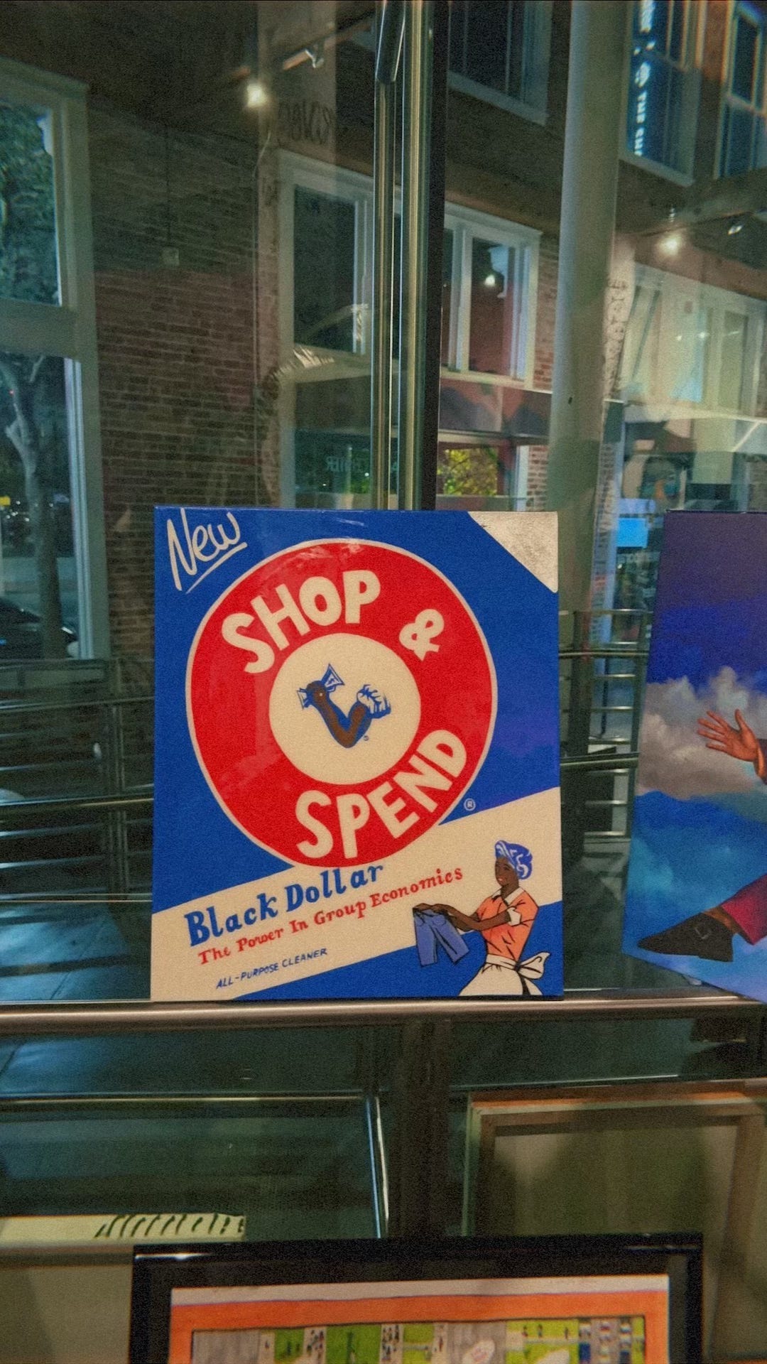 Photo of red, white, and blue vintage style artwork replicating Arm & Hammer's logo with a Black woman.