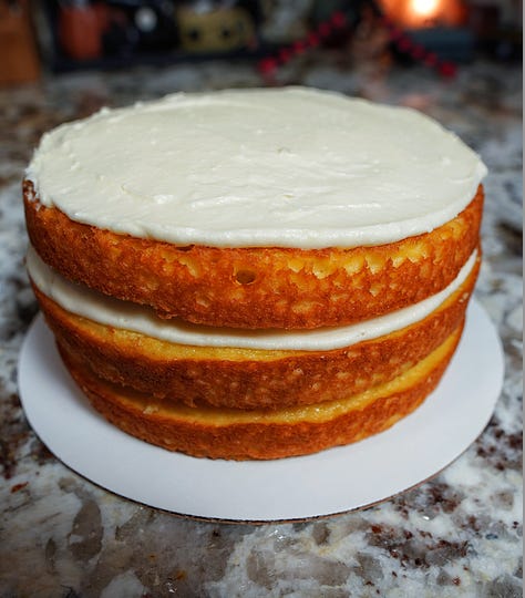 Naked 3-layer yellow cake with strawberry filling + cream cheese frosting
