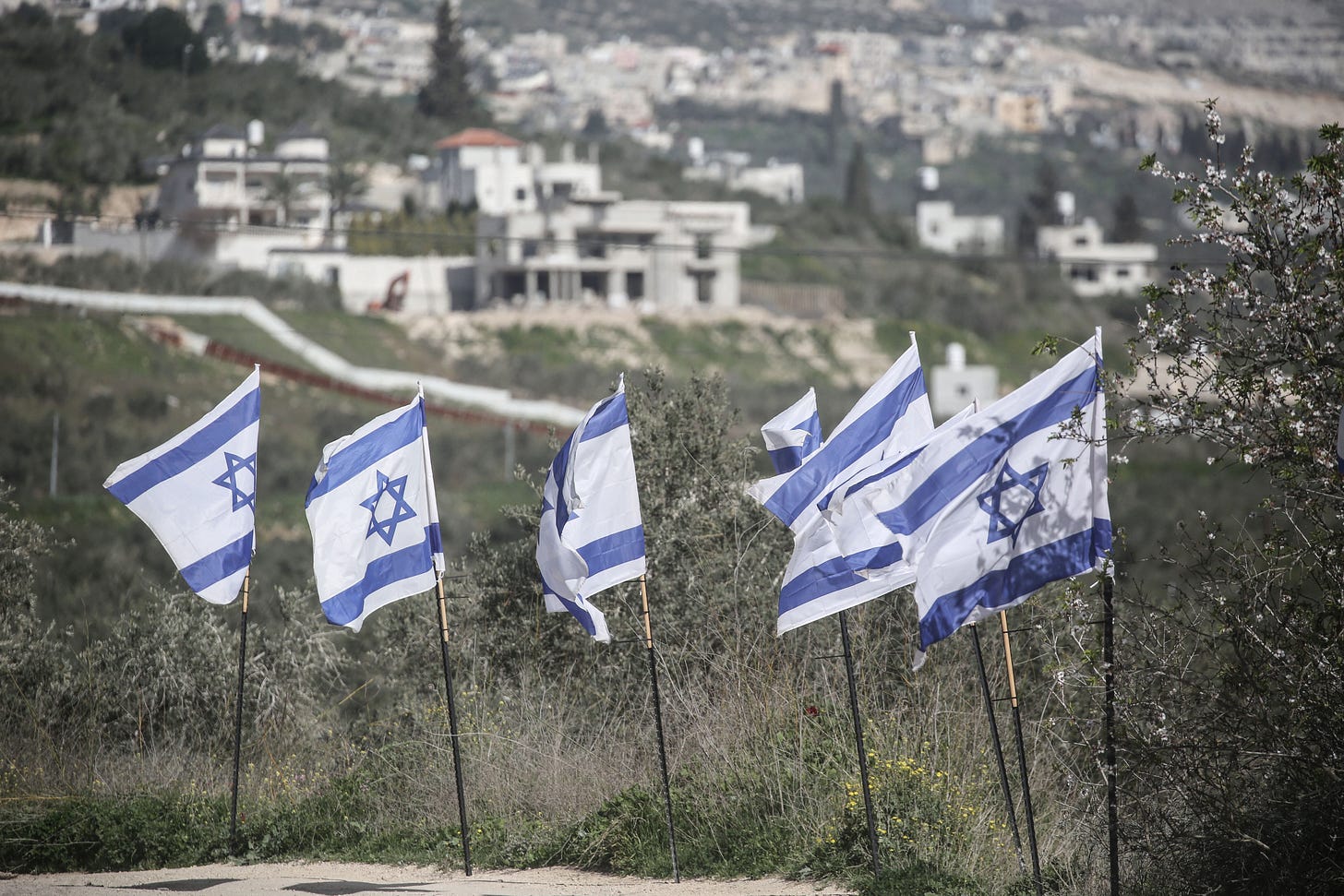 Israeli flags are seen at a Palestinian archaeological site