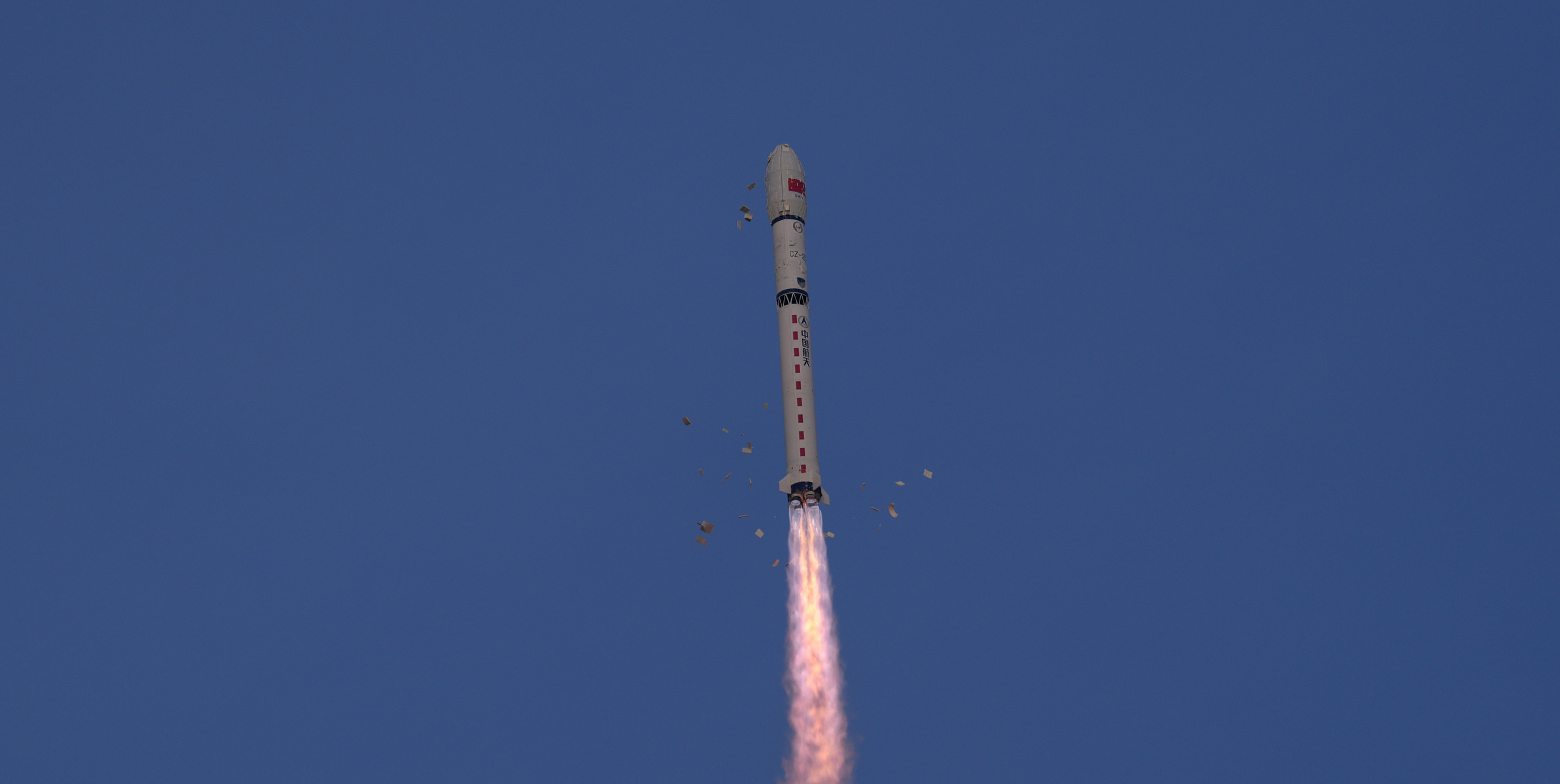 The Long March 2D Y105 vehicle during first-stage flight from the Taiyuan Satellite Launch Center on March 25/26th 2026, with pre-launch thermal insulation tiles falling away harmlessly. The Long March 2D Y105 vehicle during first-stage flight from the Taiyuan Satellite Launch Center on March 25/26th 2026, with pre-launch thermal insulation tiles falling away harmlessly.