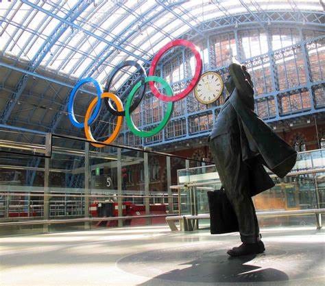 The statue of John Betjeman looks on at the Olympic logo at St Pancras International station in London in 2012 The statue of John Betjeman looks on at the Olympic logo at St Pancras International station in London in 2012