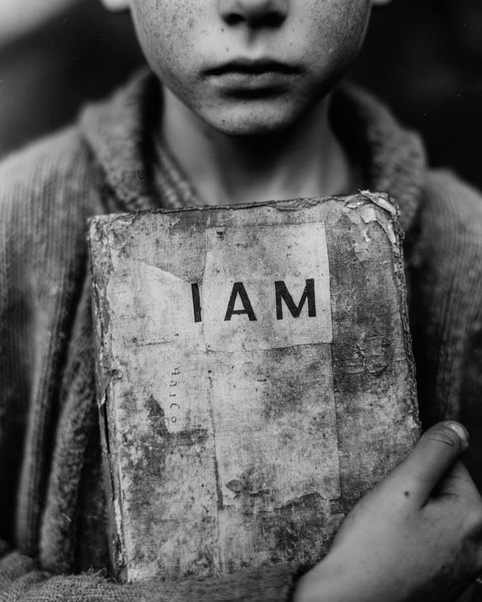 May be a black-and-white image of child and text that says 'IAM M I AN' May be a black-and-white image of child and text that says 'IAM M I AN'