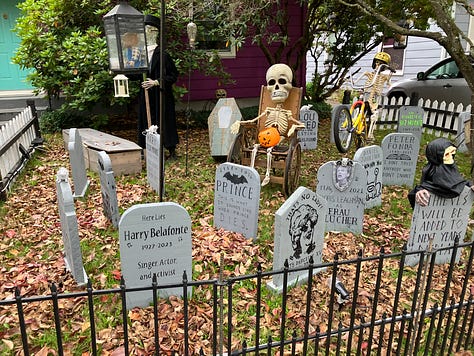 Pumpkins and leaves, skull and candle, yard with tombstones and skeleton