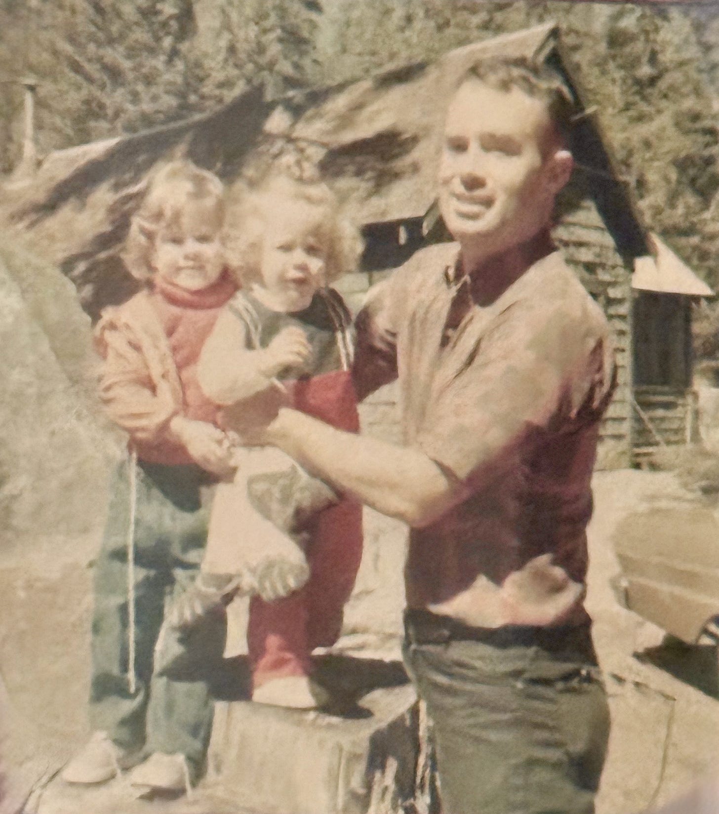 My father James, my sister Julie, and me at the family cabin, late 1960s.
