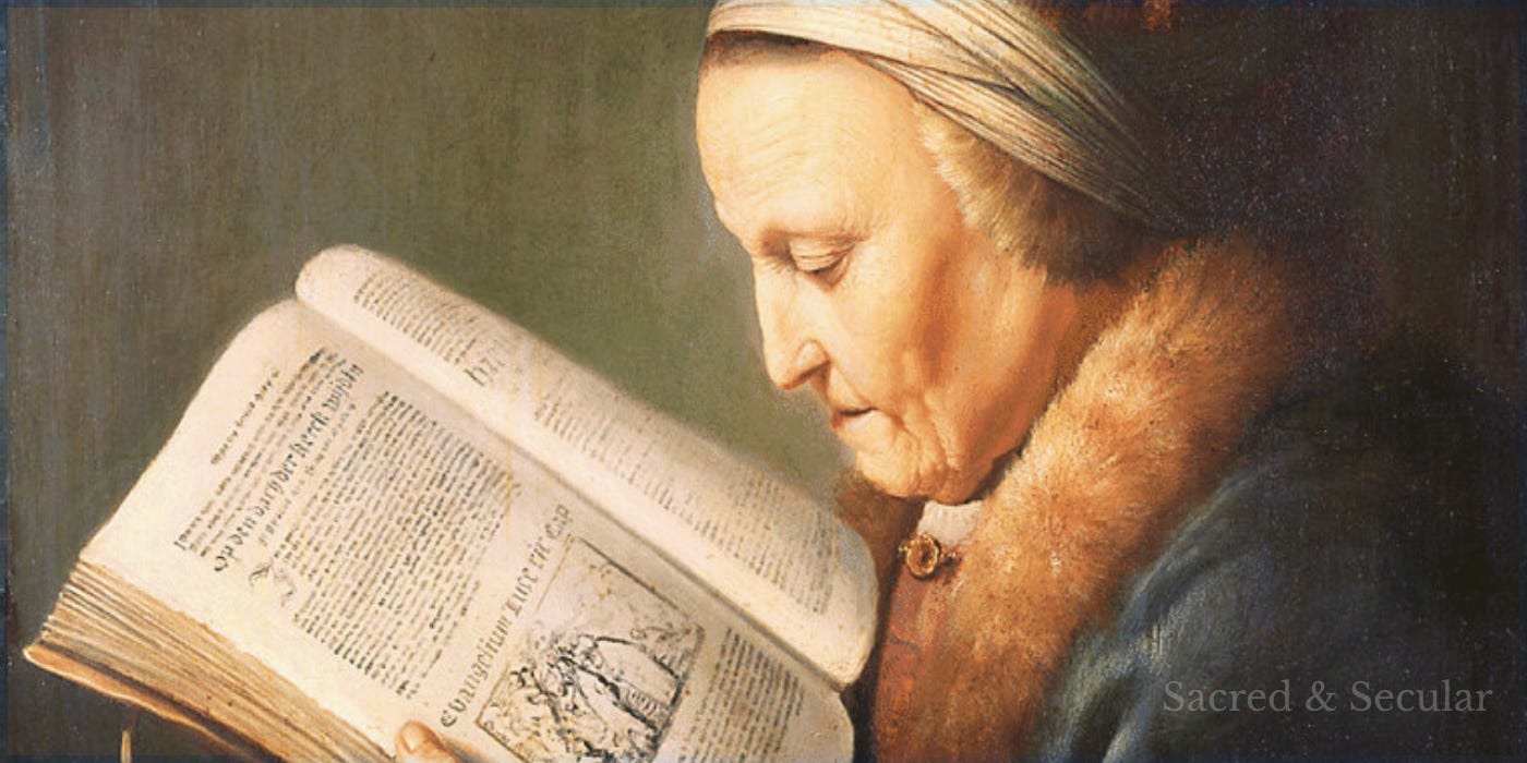 An elderly woman wearing a fur cap and richly detailed clothing looks intently at a large open religious book held in her hands. An elderly woman wearing a fur cap and richly detailed clothing looks intently at a large open religious book held in her hands.