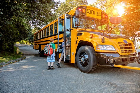 picture of kids getting on bus, speeding cameras