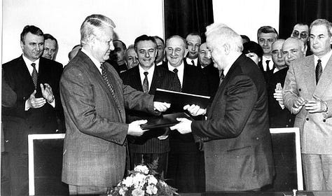 Russian President Boris Yeltsin and Georgian President Eduard Shevardnadze after signing the Treaty of Russian-Georgian Friendship, Good Neighborliness, and Cooperation (3 February 1994).